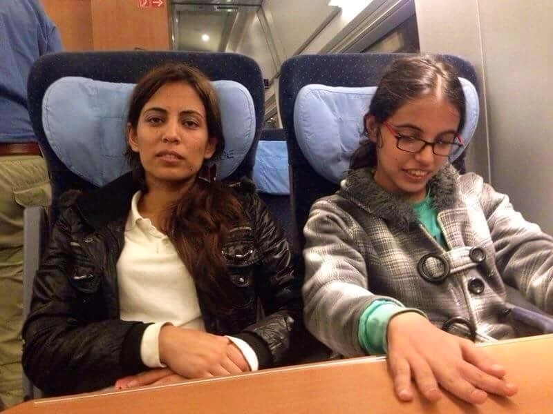 Nujeen and her sister Nasrine on a train near the end of their journey to Cologne. (Nujeen Mustafa)