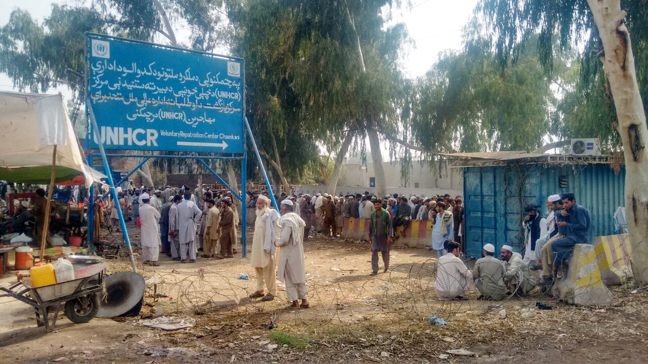 Long queues of Afghan refugees stretch out near the UNHCR repatriation center outside the Pakistani city of Peshawar. (Nabi Jan Orakzai)