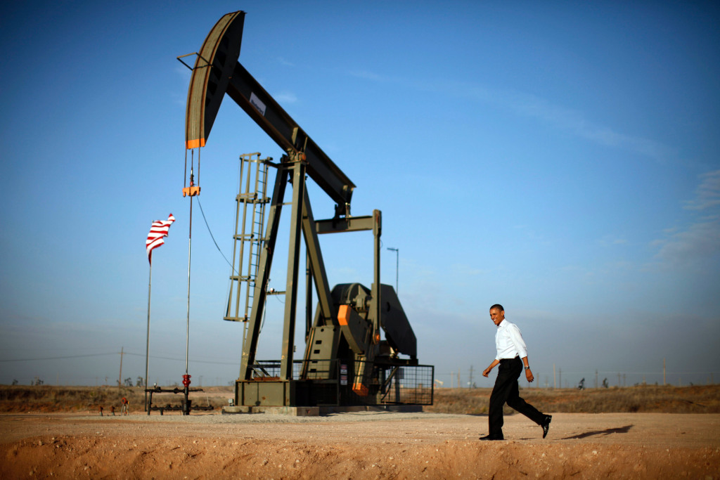 U.S. President Barack Obama walks past a pumpjack on his way to deliver remarks on energy independence at Maljamar Cooperative Association Unit in New Mexico, March 21, 2012.REUTERS/Jason Reed