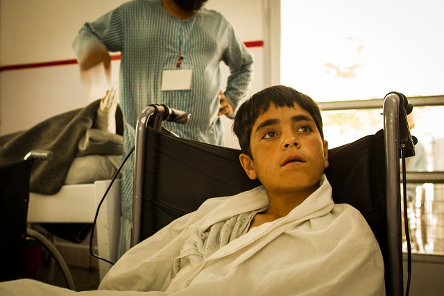 Barakatullah, a 10-year-old from Paktika Province, was riding on the back of his uncle's motorcycle when they drove over a land mine. In this photo from May 2, 2017, he sits in a wheelchair in Emergency Hospital in Kabul. He has major wounds on his right leg and left arm. Doctors at the hospital say he will need skin grafts. (Photo: Ivan Armando Flores)