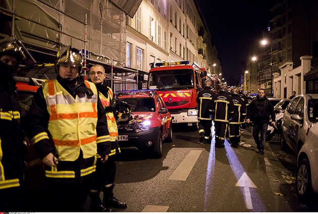 French firefighters are shown after the coordinated terrorist attacks in Paris in November 2015. (Lewis Joly/Sipa via AP)