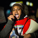 NEW YORK, NY - DECEMBER 11:  Erica Garner, daughter of Eric Garner,  leads a march of people protesting the Staten Island, New York grand jury's decision not to indict a police officer involved in the chokehold death of Eric Garner in July, on December 11, 2014 in the Staten Island Neighborhood of New York City. Protests have continued throughout the country since the Grand Jury's decision was announced last week.  (Photo by Andrew Burton/Getty Images)