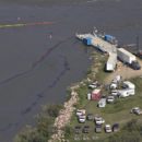 Crews work to clean up an oil spill on the North Saskatchewan river near Maidstone, Sask on Friday July 22, 2016. Husky Energy has said between 200,000 and 250,000 litres of crude oil and other material leaked into the river on Thursday from its pipeline. THE CANADIAN PRESS/Jason Franson