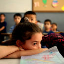 A Syrian refugee student waits in her classroom for the arrival of World Bank President Jim Yong Kim at a Lebanese public school in the Burj Hammoud area, east Beirut, Lebanon, Tuesday, June 3, 2014. Kim is on an official visit to Lebanon aimed at supporting the tiny Arab country which is hosting over a million Syrian refugees.(AP Photo/)