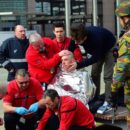 A victim receives first aid by rescuers, on March 22, 2016 near Maalbeek metro station in Brussels, after a blast at this station near the EU institutions caused deaths and injuries.  AFP PHOTO / EMMANUEL DUNANDEMMANUEL DUNAND/AFP/Getty Images