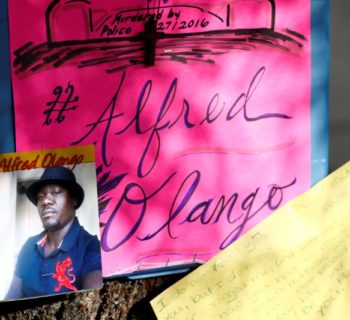 A photo of Alfred Olango, who was shot by El Cajon police, is seen at a makeshift memorial at the parking lot where he was shot in El Cajon, California, U.S. September 29, 2016.  REUTERS/Patrick T. Fallon