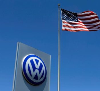 FILE PHOTO - A U.S. flag flutters in the wind above a Volkswagen dealership in Carlsbad, California, U.S. May 2, 2016.  REUTERS/Mike Blake/File Photo