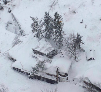 An aerial view shows Hotel Rigopiano in Farindola, central Italy, hit by an avalanche, in this January 19, 2017 handout picture provided by Italy's firefighters. Vigili del Fuoco/Handout via REUTERS