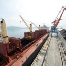 A cargo ship is loaded with coal during the opening ceremony of a new dock at the North Korean port of Rajin July 18, 2014. REUTERS/Yuri Maltsev/File Photo