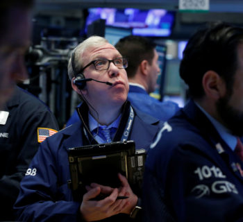 Traders work on the floor of the New York Stock Exchange (NYSE) in New York, U.S., February 16, 2017. REUTERS/Brendan McDermid