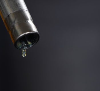 A drop of diesel is seen at the tip of a nozzle after a fuel station customer fills her car's tank in Sint Pieters Leeuw December 5, 2014. REUTERS/Yves Herman