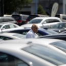 A potential car buyer looks at vehicles on a lot in Silver Spring, Maryland, September 1, 2009. REUTERS/Jason Reed