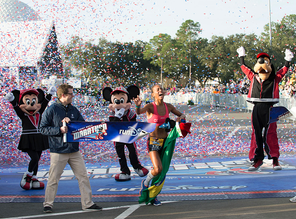 LAKE BUENA VISTA, FL - JANUARY 11: Giovanna Martins, 32, of Sao Paulo, Brazil, crosses the finish line to win the Overall Female division during the 2015 Walt Disney World Marathon on January 11, 2015 in Lake Buena Vista, Florida. The annual marathon takes runners on a 26.2-mile trek through all four Walt Disney World theme parks in Lake Buena Vista, Fla. (Photo by Preston Mack/Disney Parks via Getty Image)