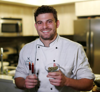 Chef Chris Sayegh holds marijuana buds and THC (Tetrahydrocannabinol) and CBD (Cannabidiol) oils as he poses in his kitchen in Los Angeles, U.S., April 29, 2016. REUTERS/Mario Anzuoni
