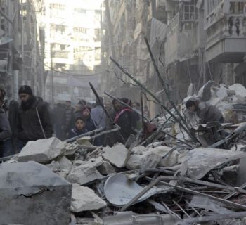 Residents inspect damage after airstrikes by pro-Syrian government forces in the rebel held Al-Shaar neighborhood of Aleppo, Syria February 4, 2016. REUTERS/Abdalrhman Ismail - RTX25GU1
