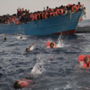 Migrants, most of them from Eritrea, jump into the water from a crowded wooden boat as they are helped by members of an NGO during a rescue operation at the Mediterranean sea, about 13 miles north of Sabratha, Libya, Monday, Aug. 29, 2016. Thousands of migrants and refugees were rescued Monday morning from more than 20 boats by members of Proactiva Open Arms NGO before transferring them to the Italian cost guards and others NGO vessels operating at the zone.(AP Photo/Emilio Morenatti)