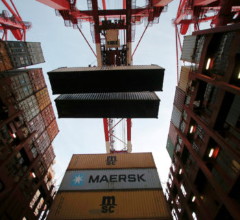 Containers are seen unloaded from the Maersk's Triple-E giant container ship Maersk Majestic, one of the world's largest container ships, at the Yangshan Deep Water Port, part of the  Shanghai Free Trade Zone, in Shanghai, China, September 24, 2016.  REUTERS/Aly Song