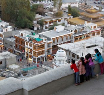 Children look down from the Royal Palace in Leh, the largest town in the region of Ladakh, nestled high in the Indian Himalayas, India September 26, 2016. REUTERS/Cathal McNaughton