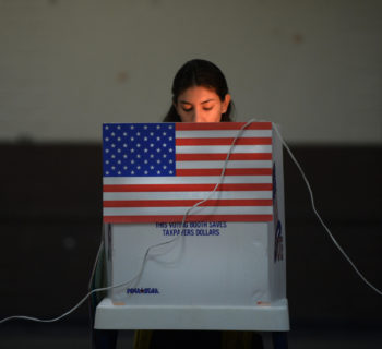 A Sun Valley resident votes at the polling station located at Our Lady of The Holy Church on election day at the Sun Valley's Latino district, Los Angeles County, on November 6, 2012 in California. AFP PHOTO /JOE KLAMAR        (Photo credit should read JOE KLAMAR/AFP/Getty Images)