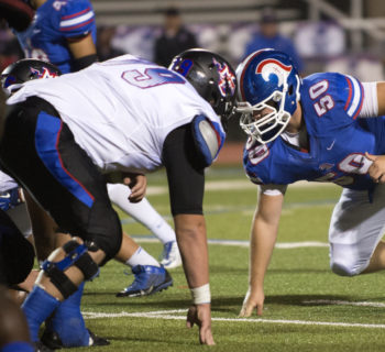 High school athlete Graham Hill, number 50, suffered a concussion in 2013 while playing football at Trinity Christian Academy in Addison, Texas.