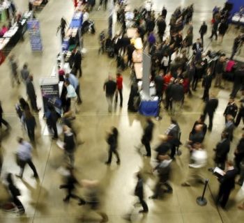 Job seekers break out to visit corporate employment personnel at a U.S. Chamber of Commerce Foundation "Hiring Our Heroes" military job fair in Washington January 8, 2016. REUTERS/Gary Cameron