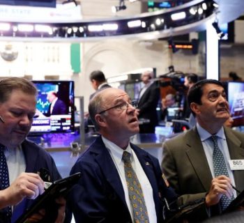 Traders work on the floor of the New York Stock Exchange (NYSE) shortly after the opening bell in New York, U.S., January 31, 2017. REUTERS/Lucas Jackson